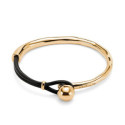 Pulsera semirígida bañada en oro 18k coN piel UNO DE 50 - PUL2551MROORO0